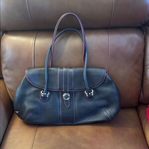 Cole Haan black pebbled leather with fuschia trim and silver tone accents